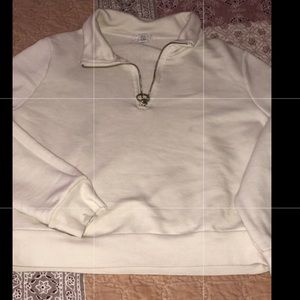 a turtle neck sweater with a little zipper